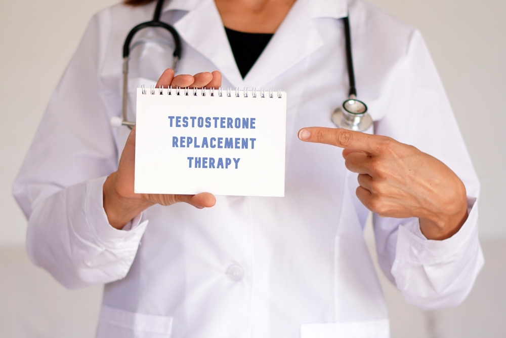 doctor holding a sign for testosterone replacement therapy in Columbia MD